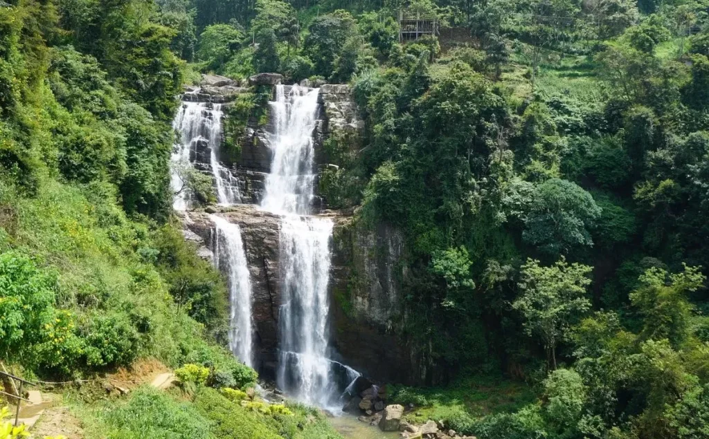 Majestic Ramboda Water Fall cascading through lush greenery in Sri Lanka.